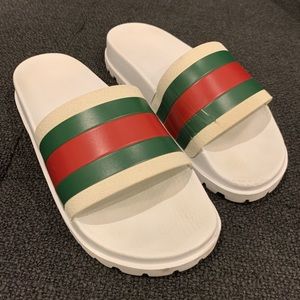 White Gucci slides, men 9/women 11, worn in good condition, slightly scuffed